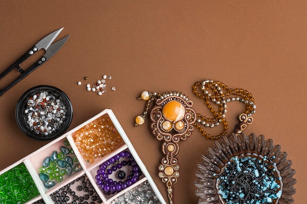 Free Photo flat lay of essentials for bead working