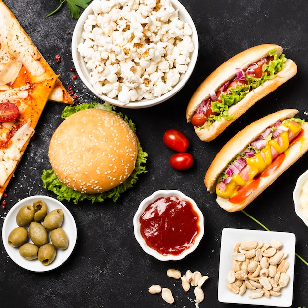 Free Photo flat lay of fast food on black table