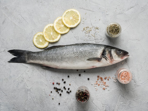 Flat lay fish with lemon and spices