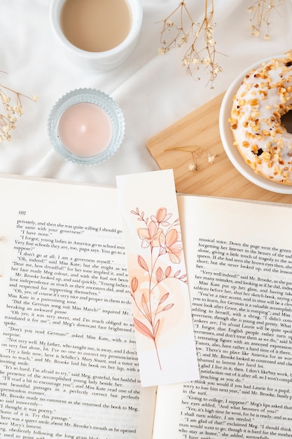 Flat lay floral bookmark and book assortment