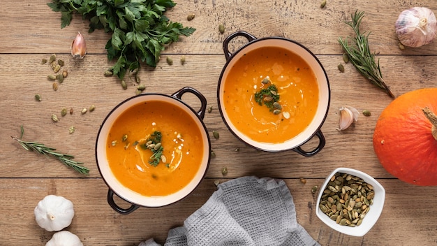 Flat lay of food ingredients with pumpkin soup