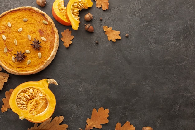 Flat lay frame with autumn leaves and pie