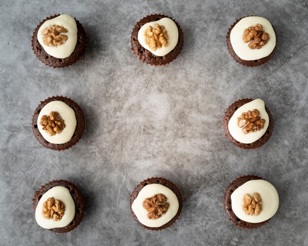 Flat lay frame with cupcakes and copy-space