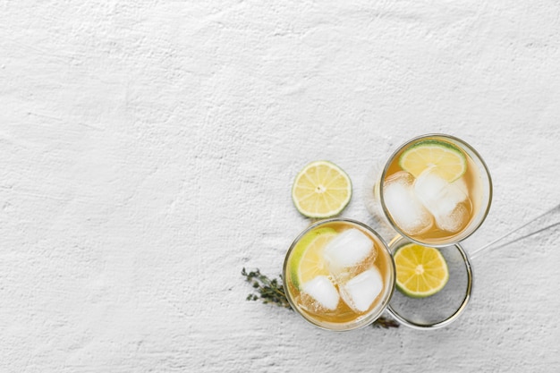 Flat lay frame with drink glasses on white background