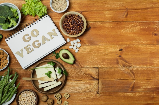 Free Photo flat lay frame with healthy food on wooden background