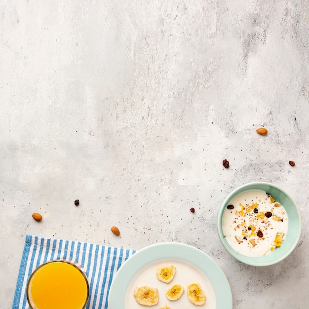 Flat lay frame with milk and cereals in bowls