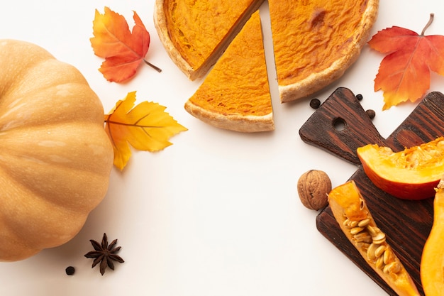 Flat lay frame with sliced pumpkin pie