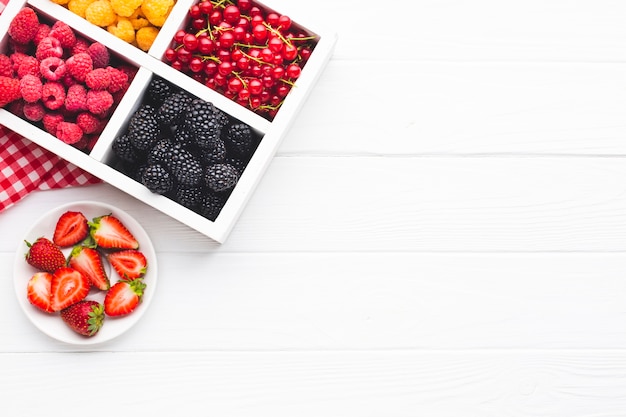 Free Photo flat-lay fresh berries with copy space