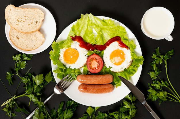 Free Photo flat lay fried egg with fresh vegetables face arrangement on plain background