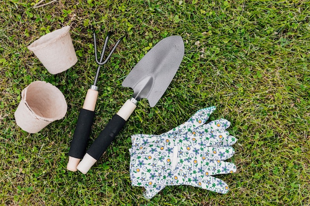 Flat lay gardening tools on the grass