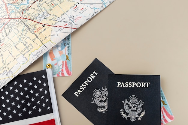 Free photo flat lay green card and passport