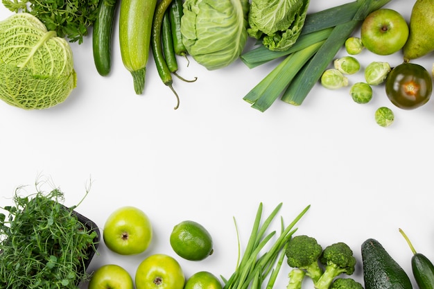 Flat lay green fruits and vegetables frame