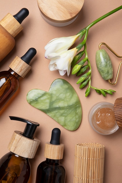 Flat lay gua sha and care products arrangement