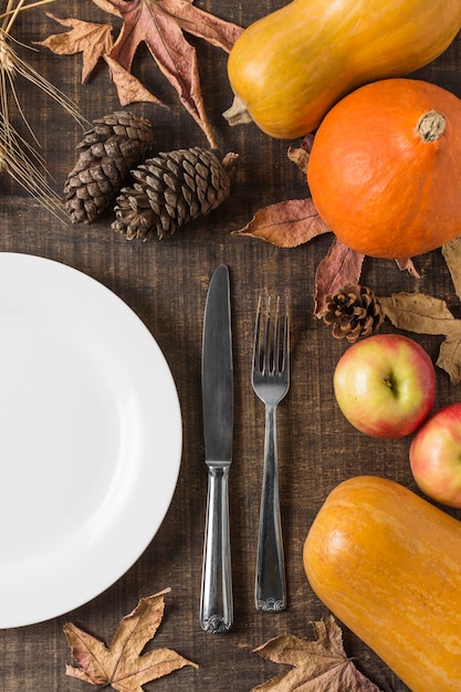 Free photo flat lay harvest arrangement with plate