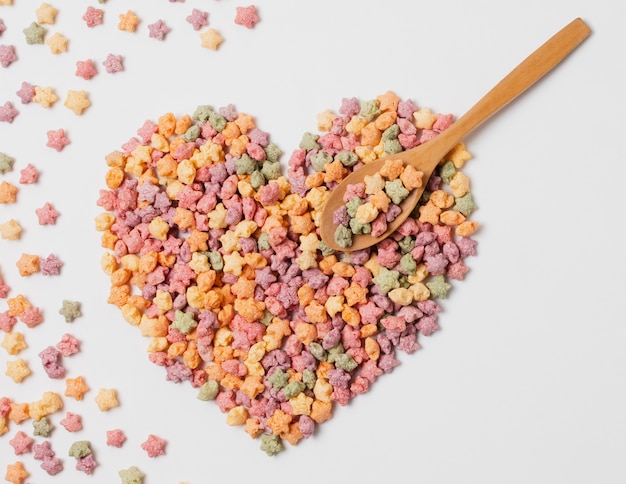 Free photo flat lay heart shaped arrangement with cereals