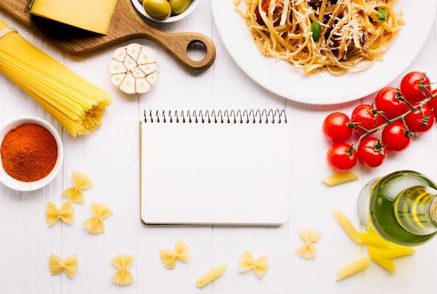 Flat lay italian food composition with notepad template