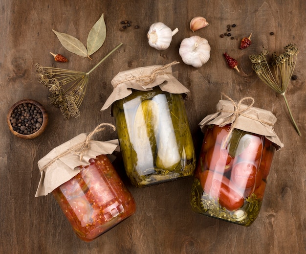 Free Photo flat lay jars with preserved vegetables