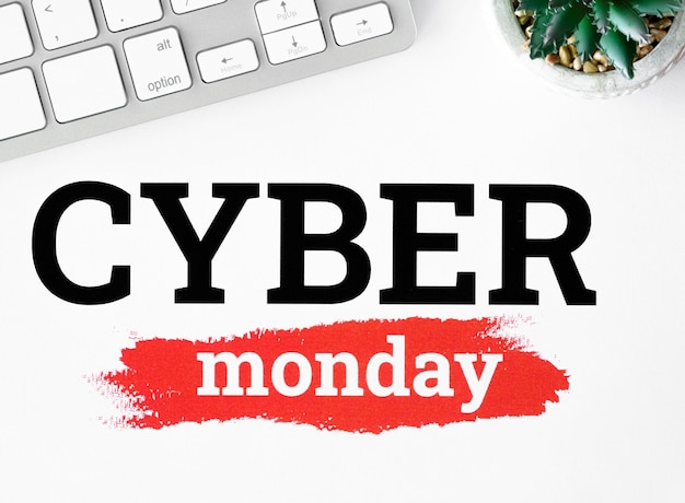 Free photo flat lay of keyboard and plant for cyber monday