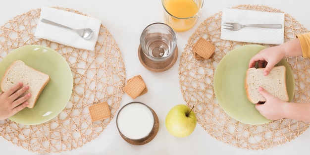 Flat lay kids having breakfast