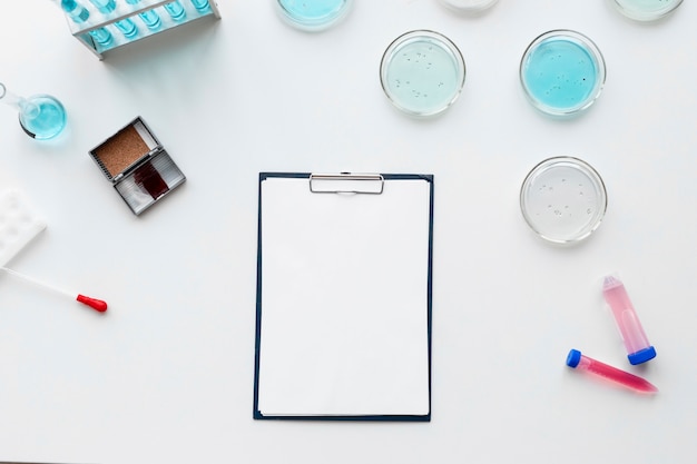 Flat lay  lab equipment and clipboard