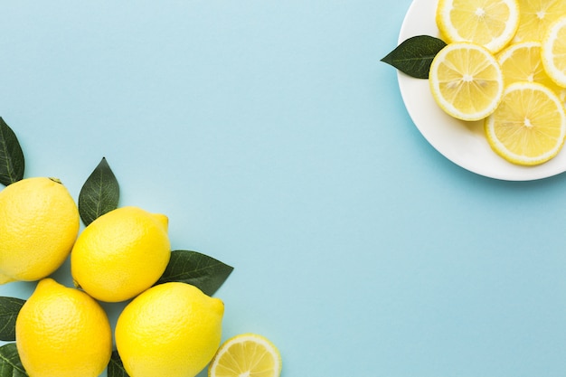 Free Photo flat lay of lemons with copy space