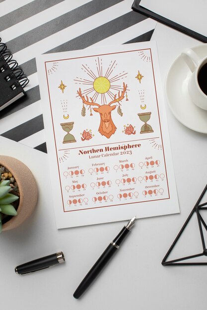 Flat lay lunar calendar with deer drawing