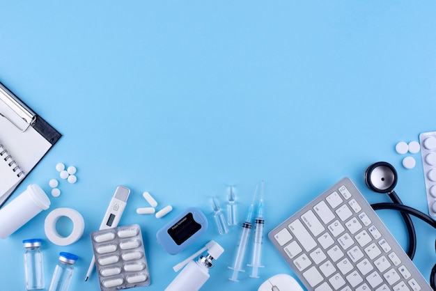 Flat lay medicine on blue background