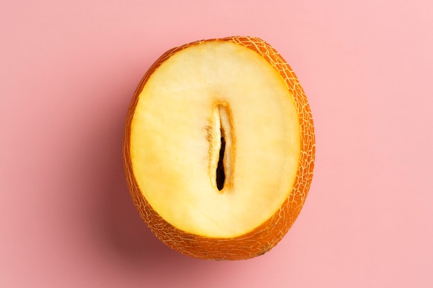 Flat lay melon on pink background