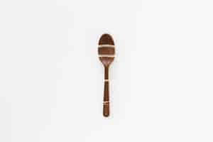 Free photo flat lay minimalist chocolate spoon