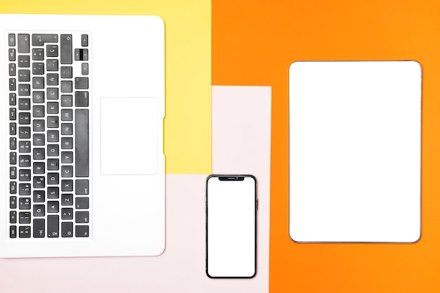 Free photo flat lay mockup devices with colourful background