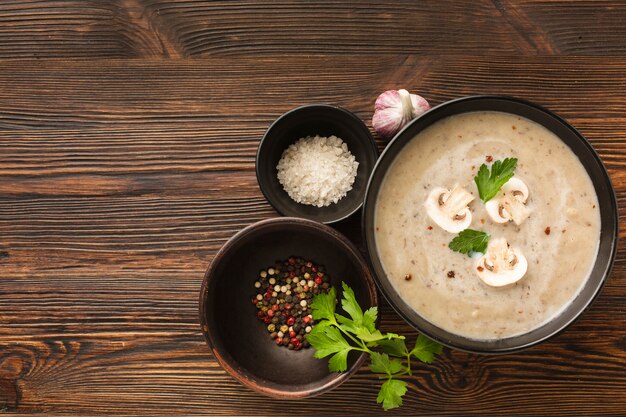 Flat lay mushrooms bisque and condiments with copy space