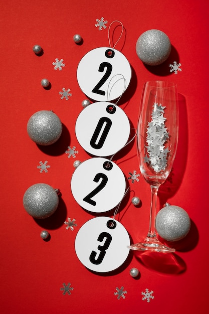 Free photo flat lay new year globes and glass