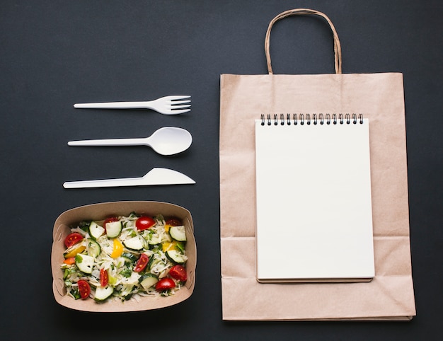 Flat lay notebook on paper bag mock-up