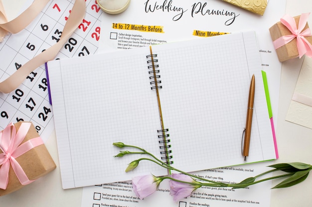 Free Photo flat lay notebook and wedding calendar