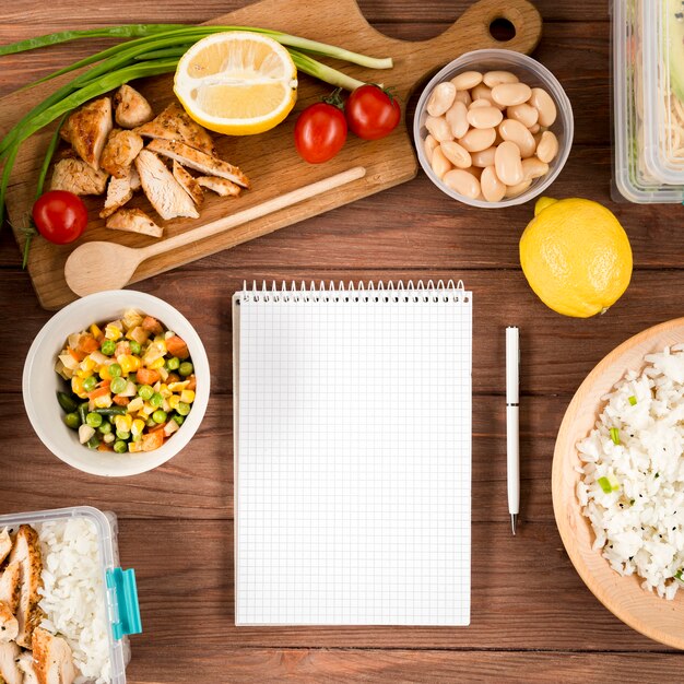 Flat lay of notepad with rice and beans