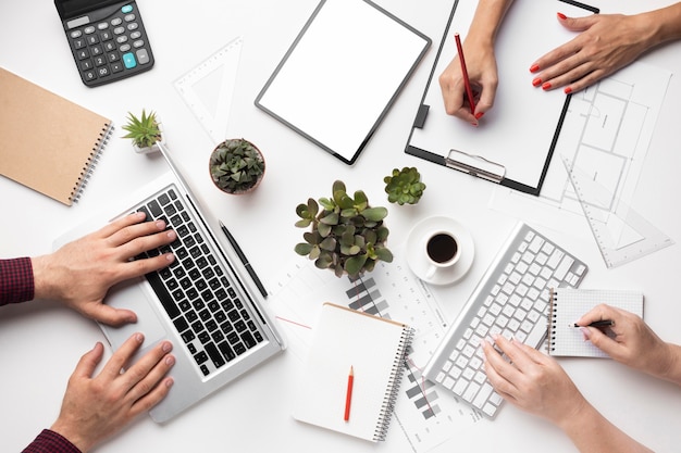 Flat lay office desk assortment with empty screen tablet