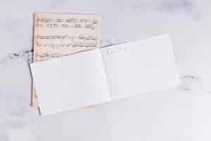 Free photo flat lay of open book for music notes