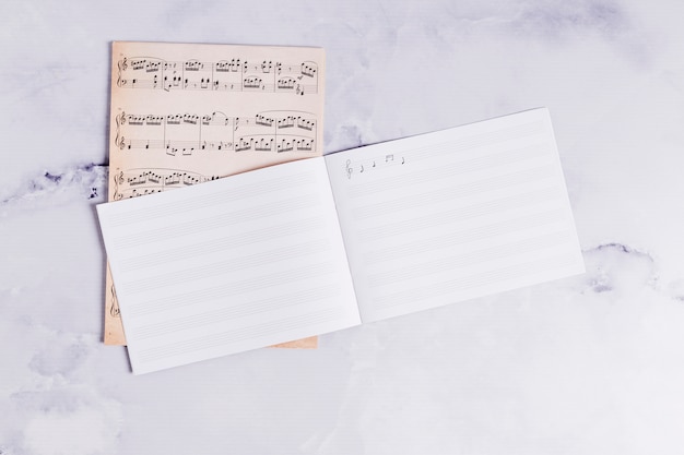 Free Photo flat lay of open book for music notes