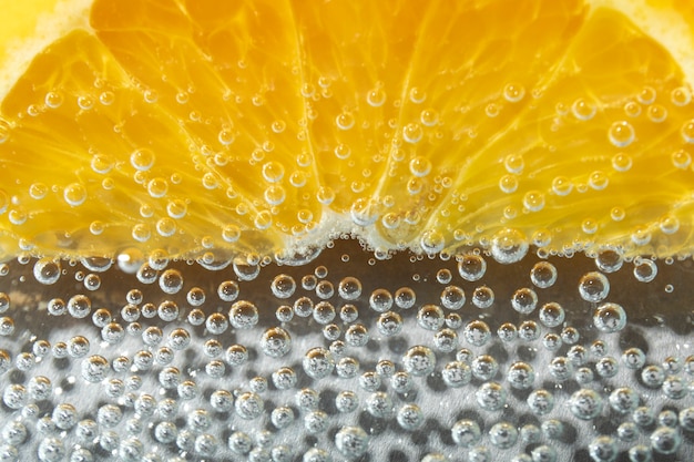 Free photo flat lay orange slice and sparkling water