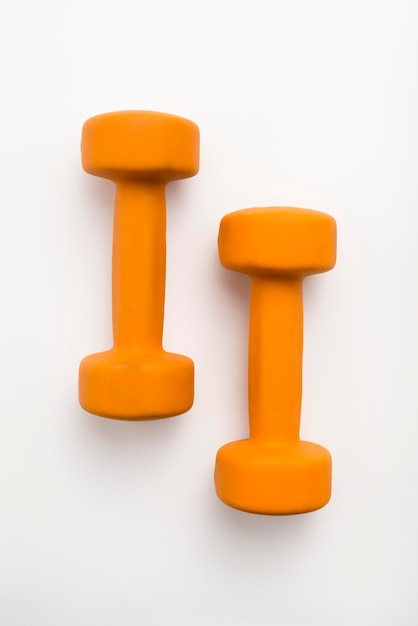 Free Photo flat lay of orange weights