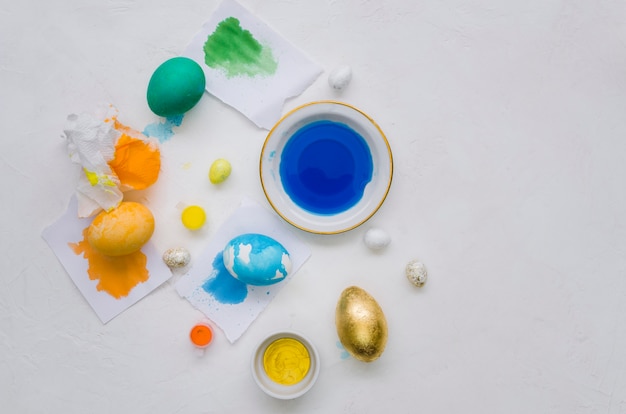 Free photo flat lay of painted eggs with dye for easter