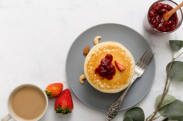 Free photo flat lay pancakes with homemade delicious jam