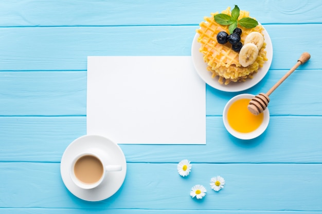 Free photo flat lay paper card mockup on breakfast table