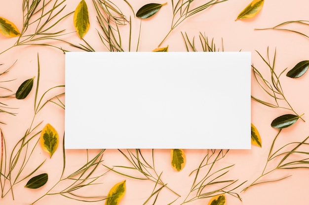 Free photo flat lay of paper card template with leaves