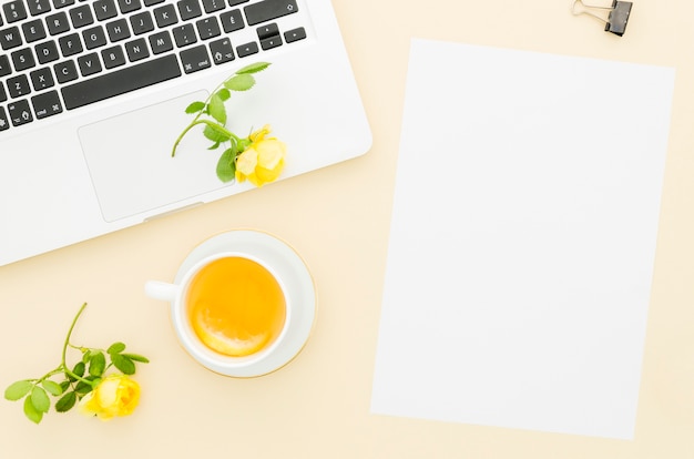 Free Photo flat lay paper mockup next to laptop