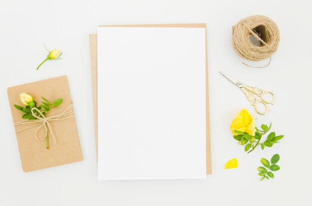 Flat lay paper mockup with floral elements