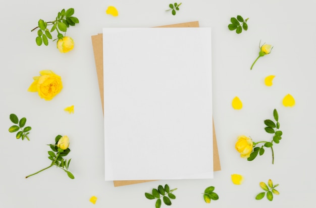 Flat lay paper mockup with floral elements