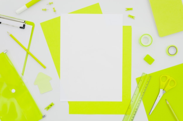 Free photo flat lay paper mockup with office supplies