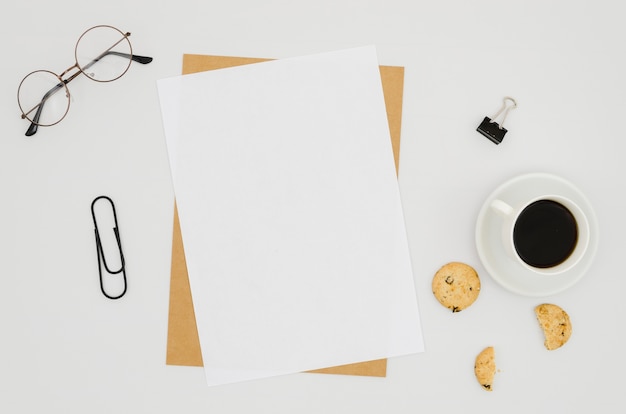 Flat lay paper mockup on workspace