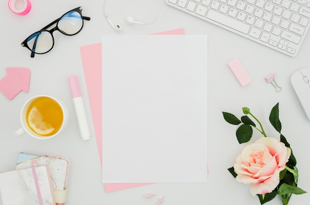 Flat lay paper mockup on workspace